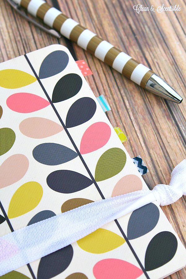 How to Keep Yourself Organized with a Notebook. Small notebook with washi tape dividers.