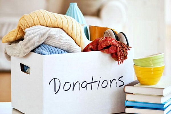 How to get organized. Donation box filled with household items to donate.