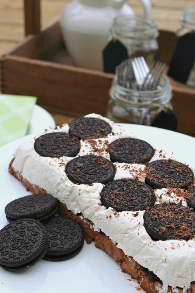This Oreo cookie frozen dessert is quick and easy to make and always a hit at summer parties.  Without the dripping mess of an ice cream cake!