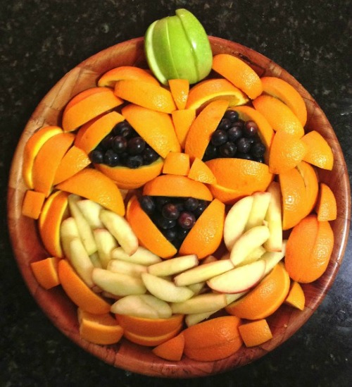 Cute fruit pumpkin plus lots of other fun and healthy Halloween food ideas.