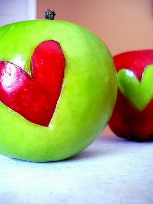 Apples with cut out hearts for a healthy Valentines's Day snack.