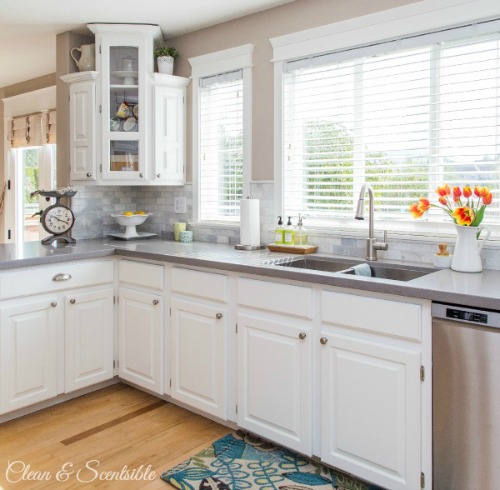 Beautiful white kitchen with quartz counter tops. // cleanandscentsible.com