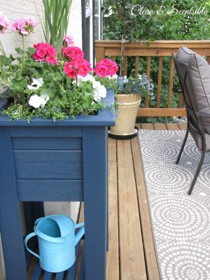 Wooden planter makeover using Behr Premium solid colour weather proofing in Atlantic.