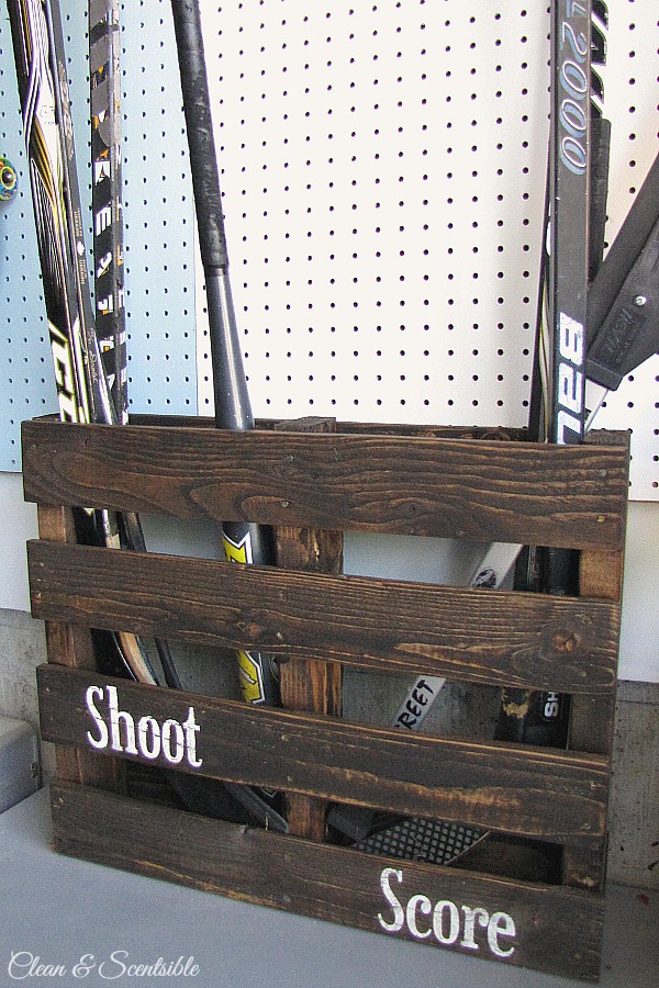 Turn an old pallet into sports equipment storage! // cleanandscentsible.com