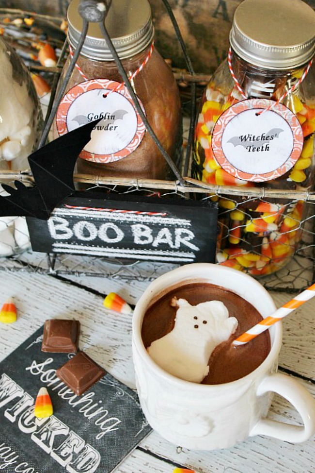Cute portable Halloween hot chocolate bar with mug of hot chocolate.