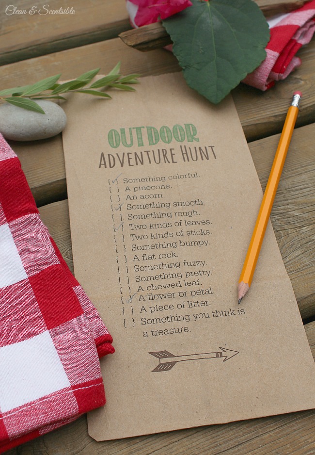 Outdoor scavenger hunt printable on a paper bag for collecting items.