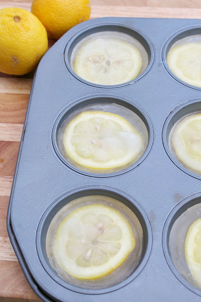 Lemon slices with water in muffin tins to freeze for large ice cubes.