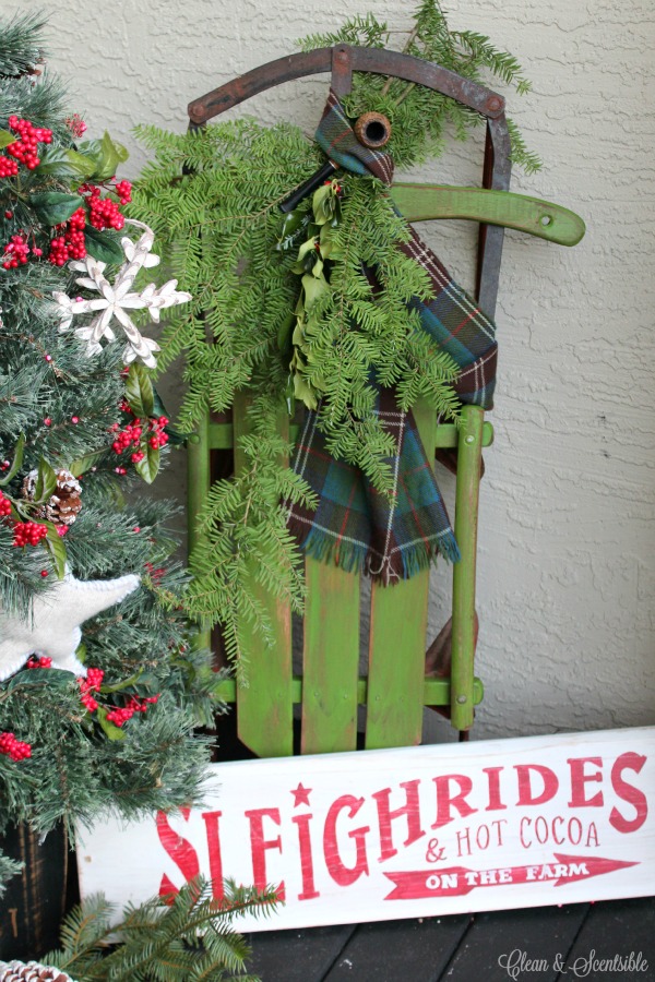 Rustic Christmas front porch with lots of decorating ideas and tutorials.