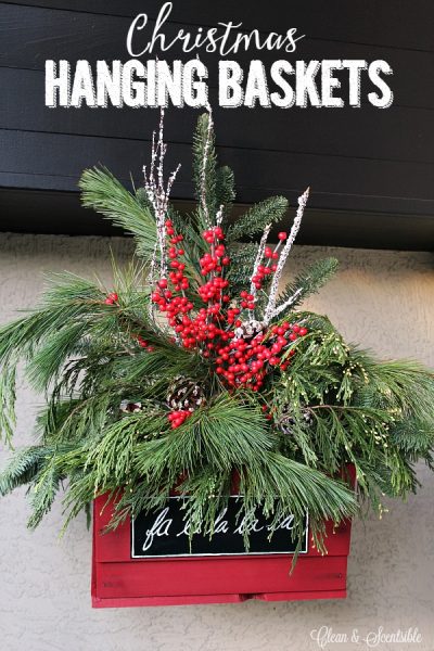 Pretty rustic Christmas hanging baskets with fresh greenery.