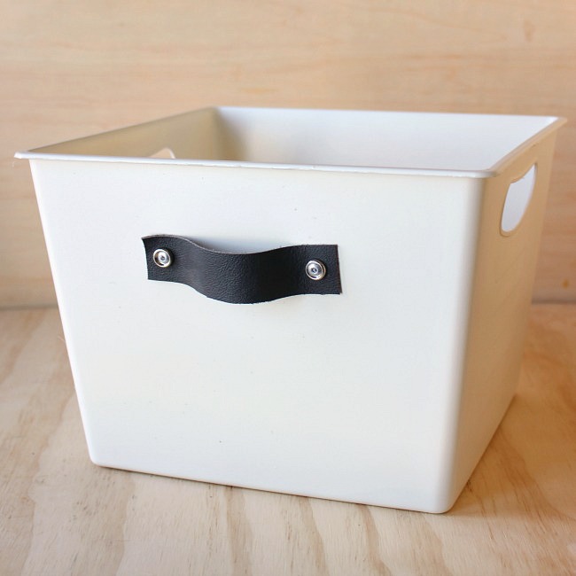 Dress up those boring dollar store bins with this easy tutorial for stylish DIY storage totes.
