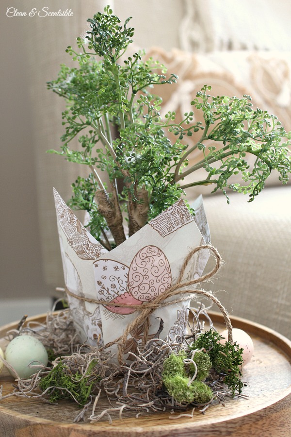 Wrap a flower pot with this cute Eater wrapping paper for inexpensive Easter decor. Free printable paper included.