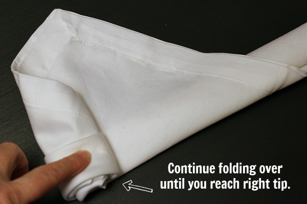 How to fold a napkin into a rose bud.