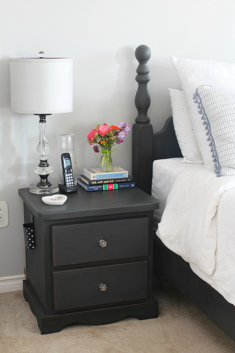 Black nightstand with flowers 