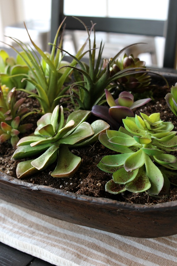 Quick and easy succulent planter in a dough bowl. You can't even tell that these are faux!