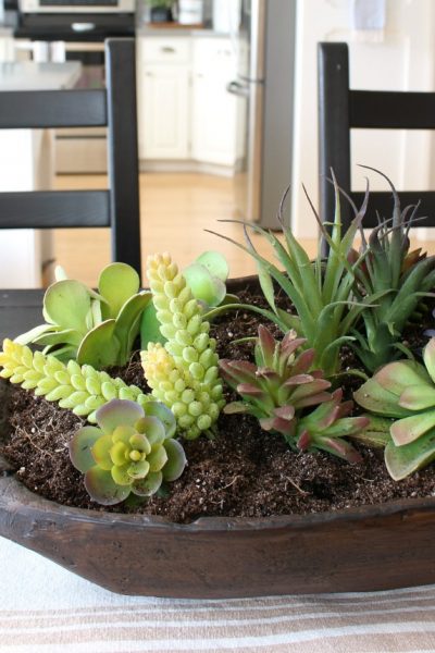 Quick and easy succulent planter in a dough bowl. You can't even tell that these are faux!