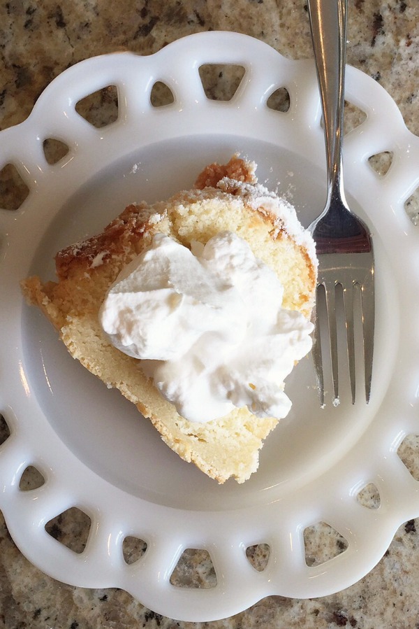 Delicious sour cream pound cake recipe with homemade whipped cream. Must try!