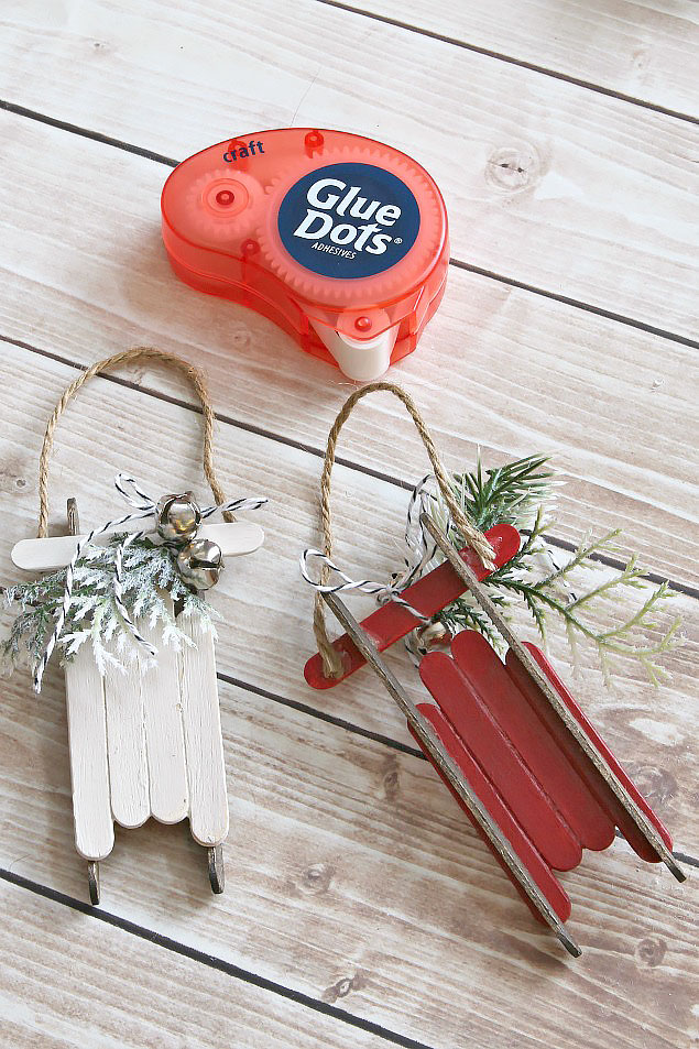Popsicle stick sleds. These easy handmade Christmas ornaments can be dressed up or done as a simple kids Christmas craft.