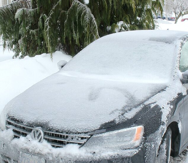 Car covered in snow and ice.