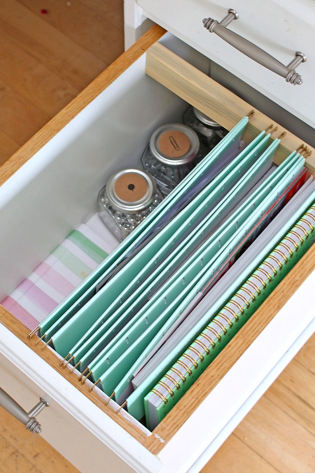 Organized desk drawer with file folders.