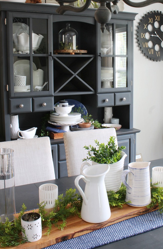 Farmhouse style dining room with blue, white, and greens.