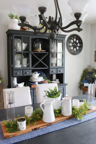 Farmhouse style dining room with blue, white, and greens.
