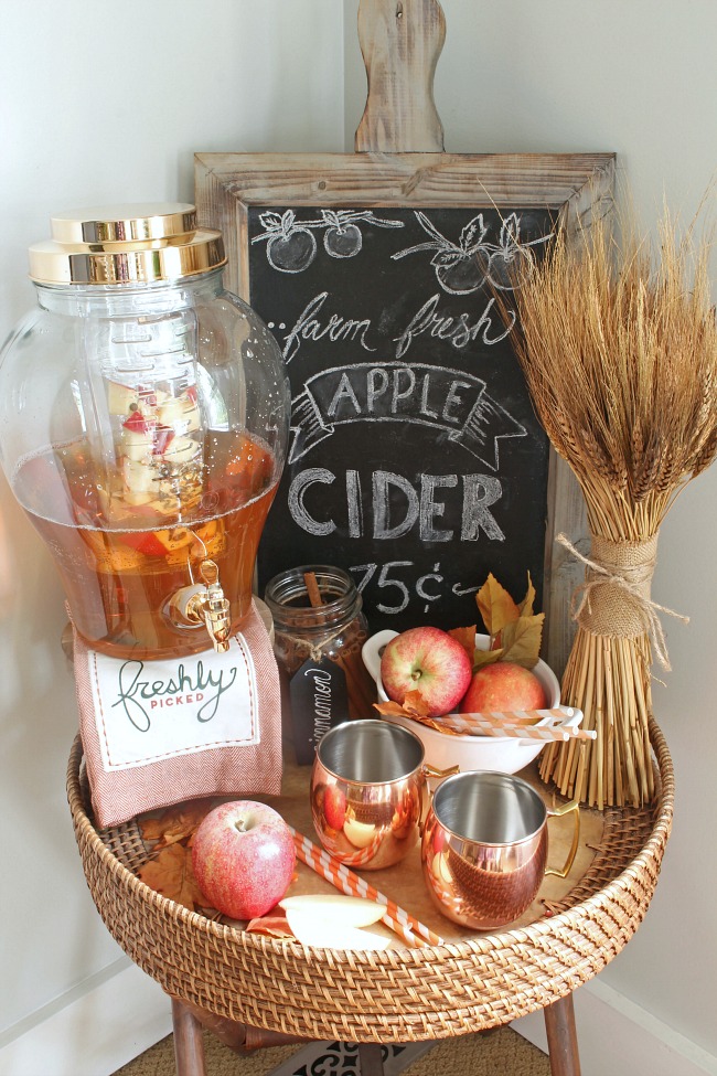 Apple cider bar on a round wood table.