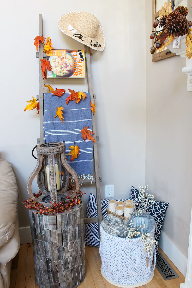 Family Room Fall Decorating Ideas. Easy fall decorations in traditional autumn colors with pops of blue.