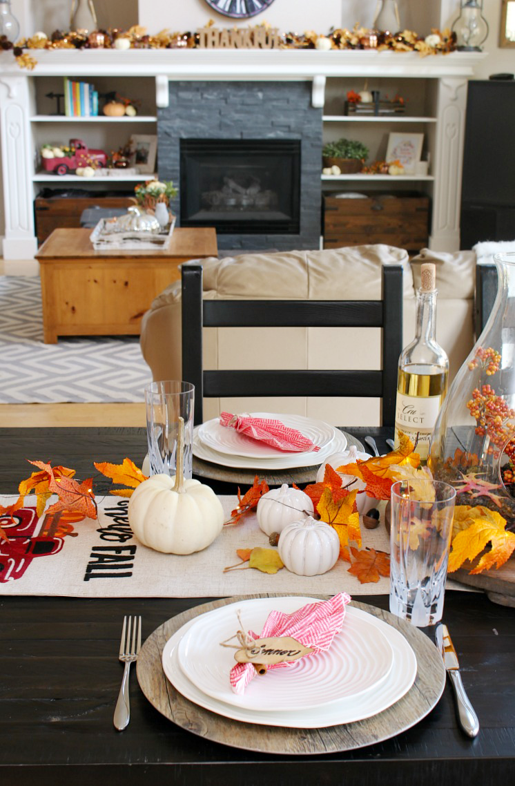 Pretty Thanksgiving tablescape with a DIY leaf napkin fold place setting.