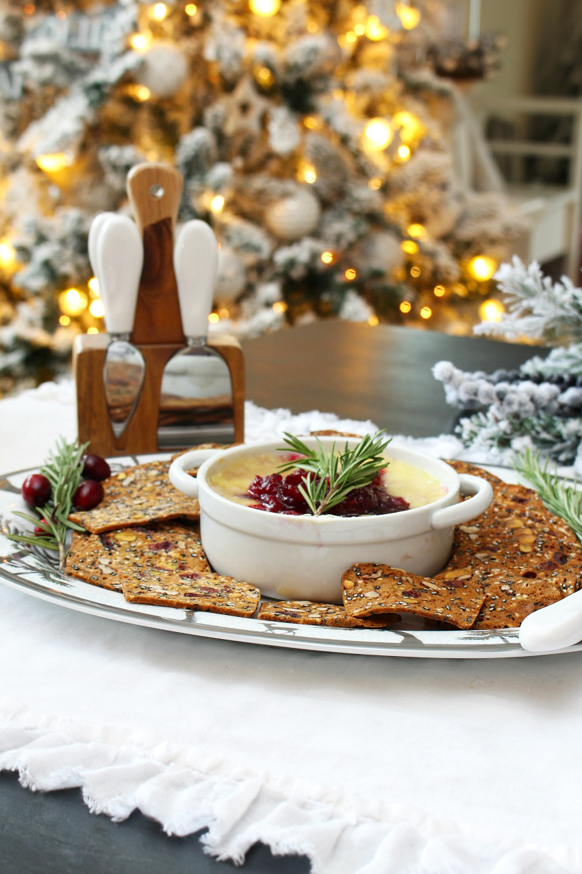 This delicious cranberry baked brie is simple to make and full of flavour - it's the perfect appetizer for those holiday parties and gatherings. You'll probably want to make extra of the homemade cranberry sauce for other recipes.