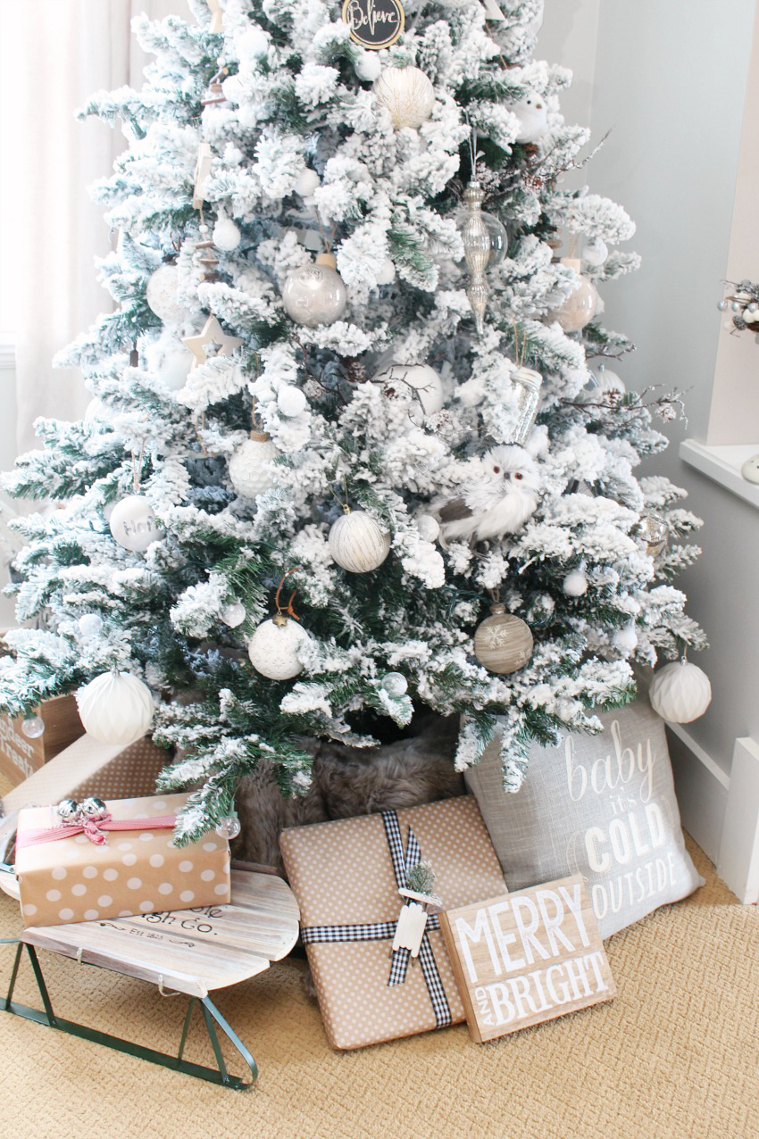Beautiful flocked Christmas tree. Pretty Christmas decorating ideas for the dining room.
