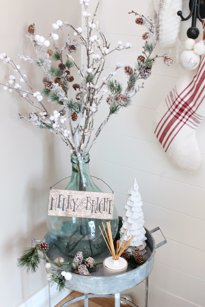 Christmas Front Entry Decorating Ideas. Pretty and simple ideas to dress up your front entry for the holidays. Love the red and white farmhouse feel!