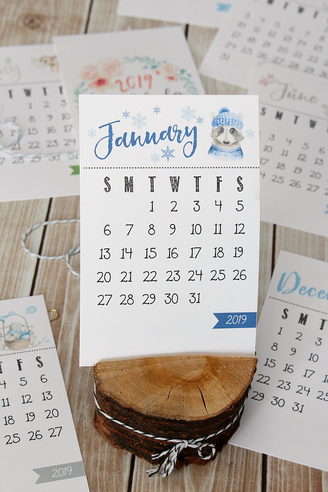 Free printable 2019 calendar in a wood slice holder.