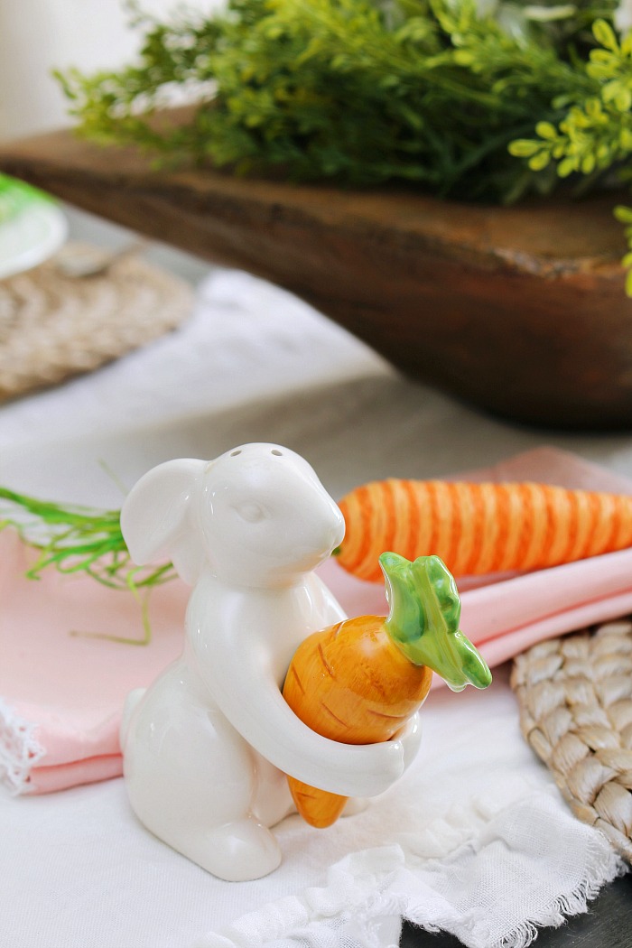 Easter table setting. Easter bunny salt and pepper shaker with carrot.