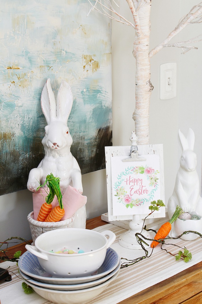 Easter display with white ceramic bunnies.