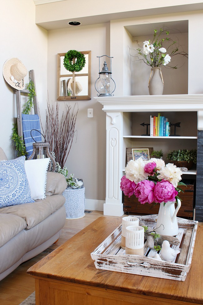 Pretty farmhouse style family room with pink peonies.