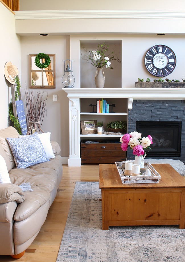 Pretty farmhouse style family room with pink peonies.