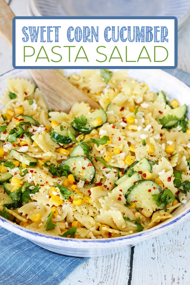 Sweet corn and cucumber pasta salad recipe in a blue and white bowl.