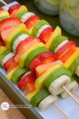 Colorful fruit kabobs for summer parties.