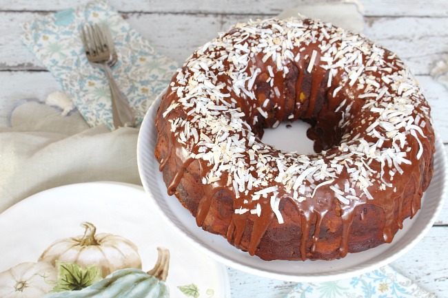 Chocolate coconut pumpkin bundt cake with a delicious chocolate glaze and topped with toasted coconut.