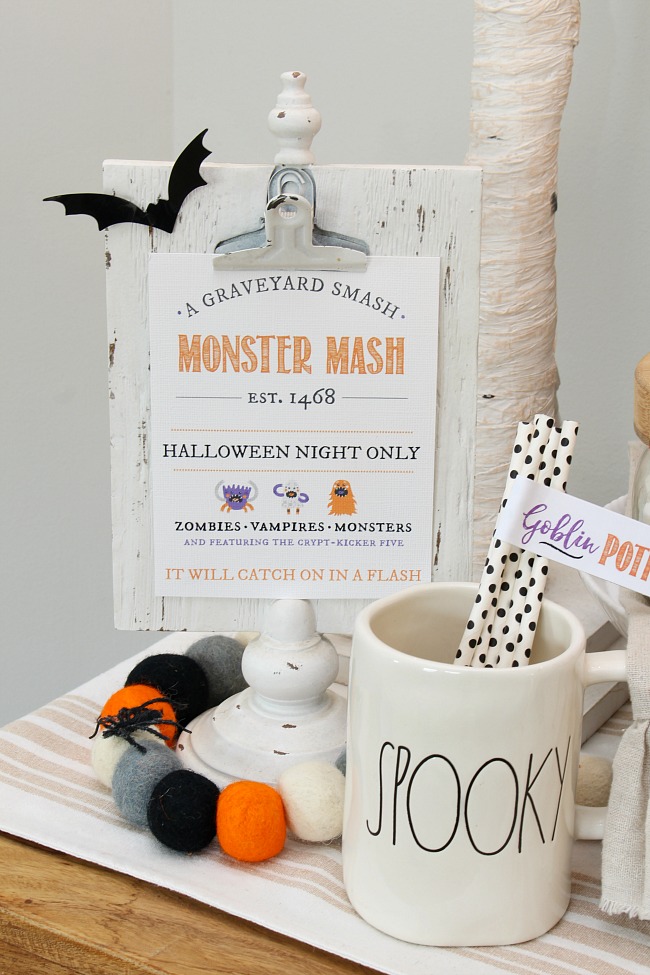 Monster Mash Halloween printable displayed on a clipboard.