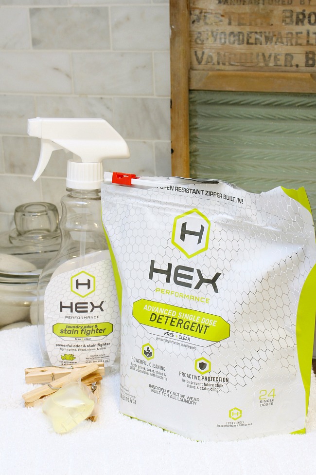 The best laundry tips. HEX laundry detergent and stain remover on white towel.