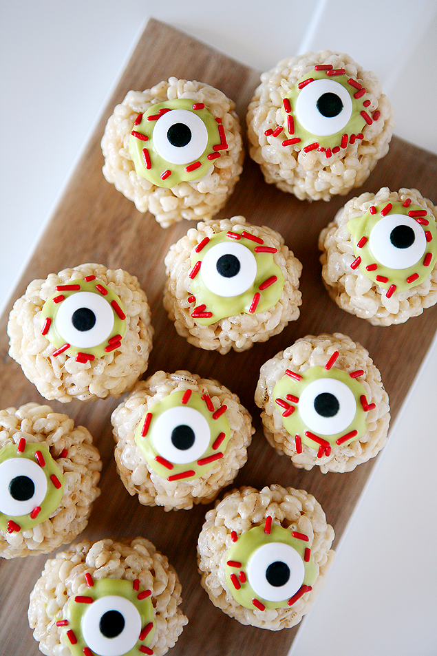 Zombie eyeball Rice Krispie treats using sprinkles and a candy eye.
