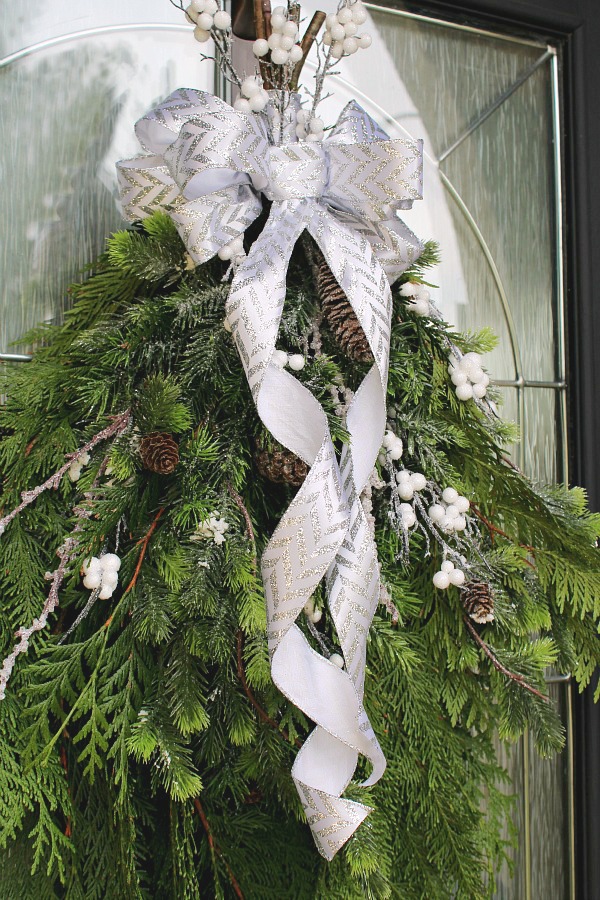 How to make a bow from ribbon. Pretty bow made from ribbon on a swag wreath.