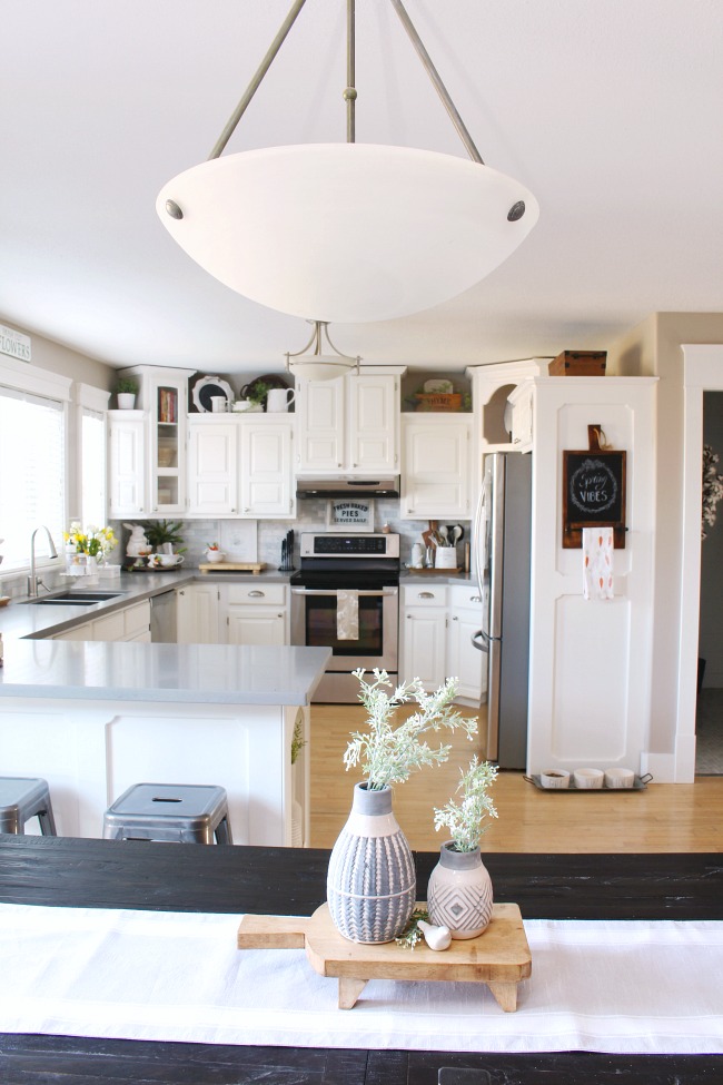 White farmhouse style kitchen decorated with simple spring touches.