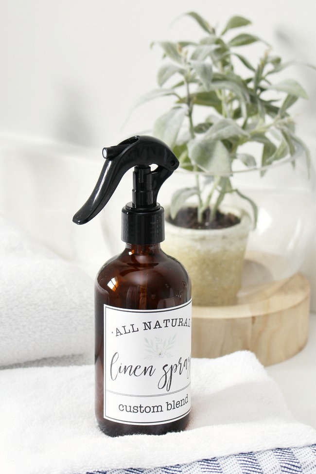 DIY linen spray in an amber spray bottle with free printable linen spray labels.