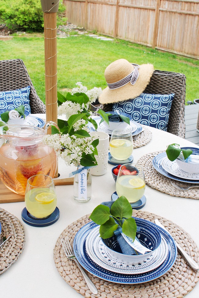 Simple summer entertaining idea. Summer tablescape using blues and whites with fresh flowers and greenery.