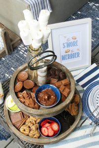 Cute DIY s'mores bar on a tiered tray.