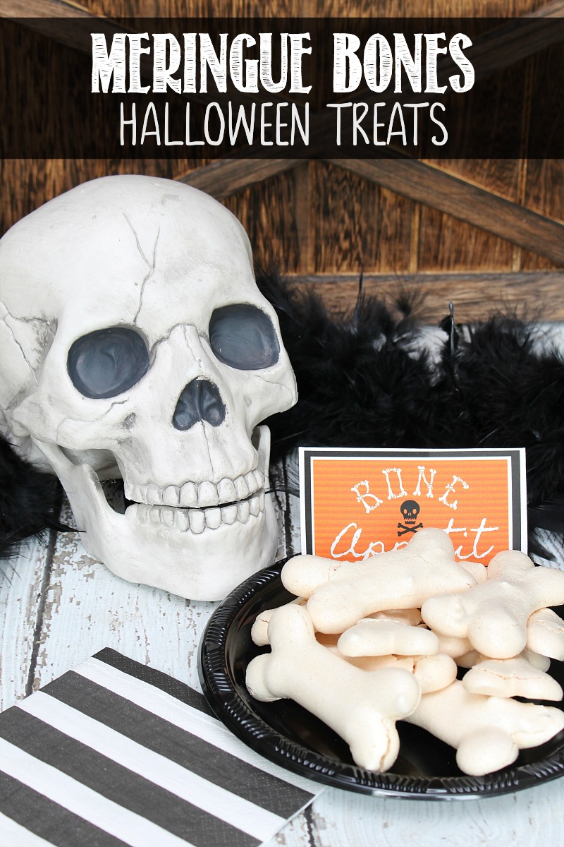 Meringue bones Halloween treats on a black plate with Bone Appetit printable.