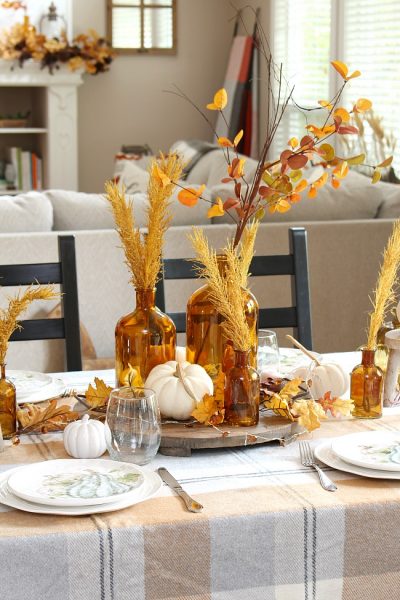 Harvest moon fall tablescape ideas for fall or Thanksgiving. Beautiful amber glass and muted fall colors in a farmhouse style kitchen.
