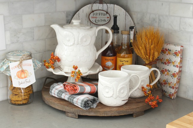 Cute fall beverage bar with owl tea set and fall-flavored syrups.